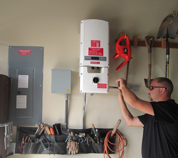 Owner setting up solar panel system